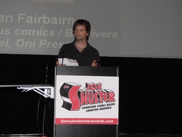 Mike - friend of Nathan Fairbairn accepting the Outstanding Comic Book Colourist Award