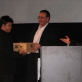Kevin Boyd gives prize box of books to an audience member